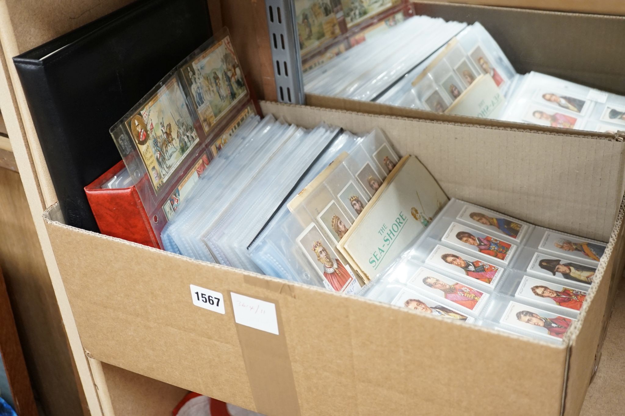 A large collection of pre and post war cigarette cards, in two albums, mounted in a plastic sheets and loose